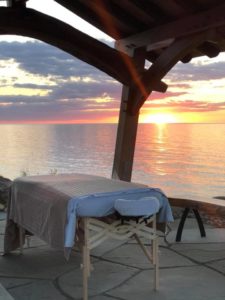 Massage Table Near Calm Lake Erie Setting at Sunset